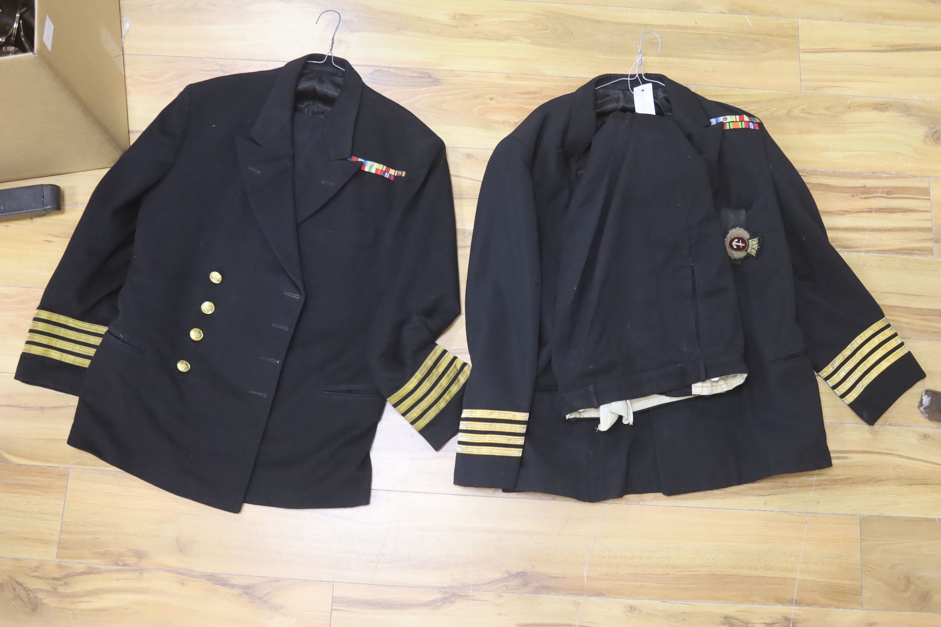 Two Royal Navy Captains jackets and associated trousers